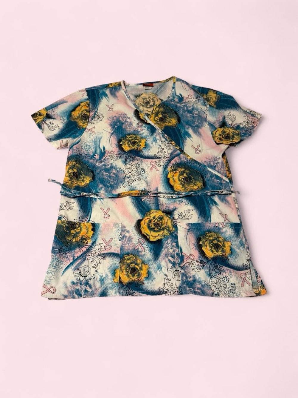 Floral Short Sleeve Wrap-Style Scrub Top in Blue & Yellow with pink ribbons